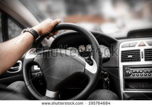 Photo of a man driving his car