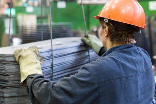 Photo of a factory worker in a hard hat - Workers' Compensation Insurance in Greater Boston & Massachusetts