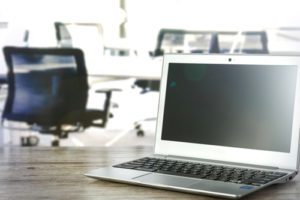 Photo of an open laptop sitting on a desk