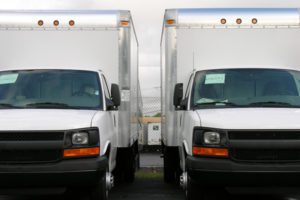 Photo of two commercial box trucks
