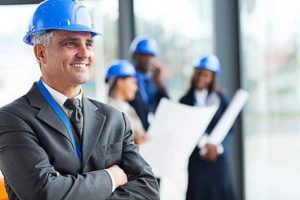 Photo of a businessman in a hard hat - Links to business insurance page